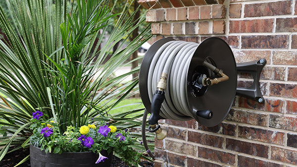 How to Mount a Garden Hose Reel to Your House