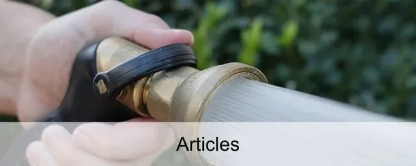 Hand holding a hose nozzle spraying water with text 'Articles' at the bottom