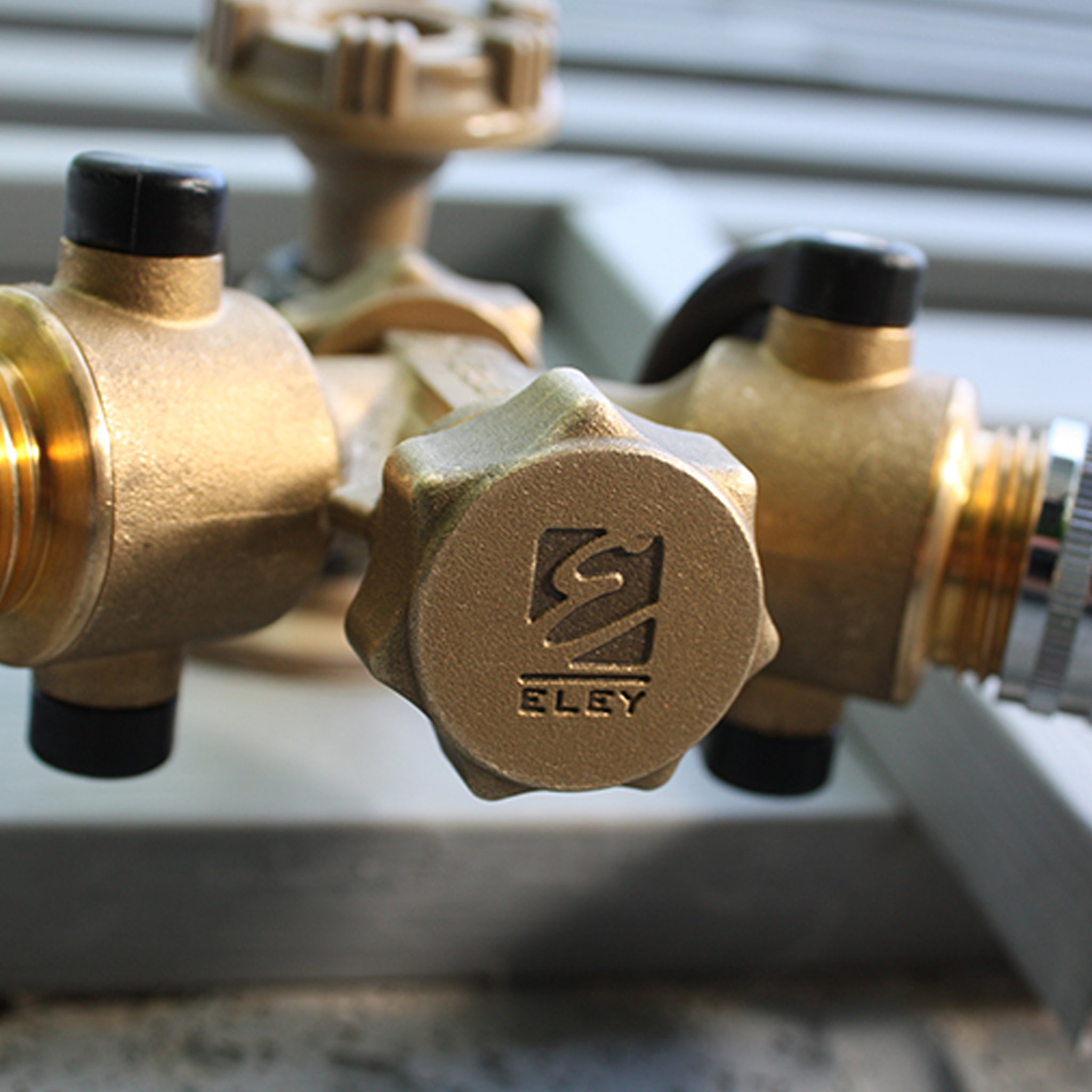 Eley 3/4-inch brass garden hose cap on garden hose 2-way Y-valve