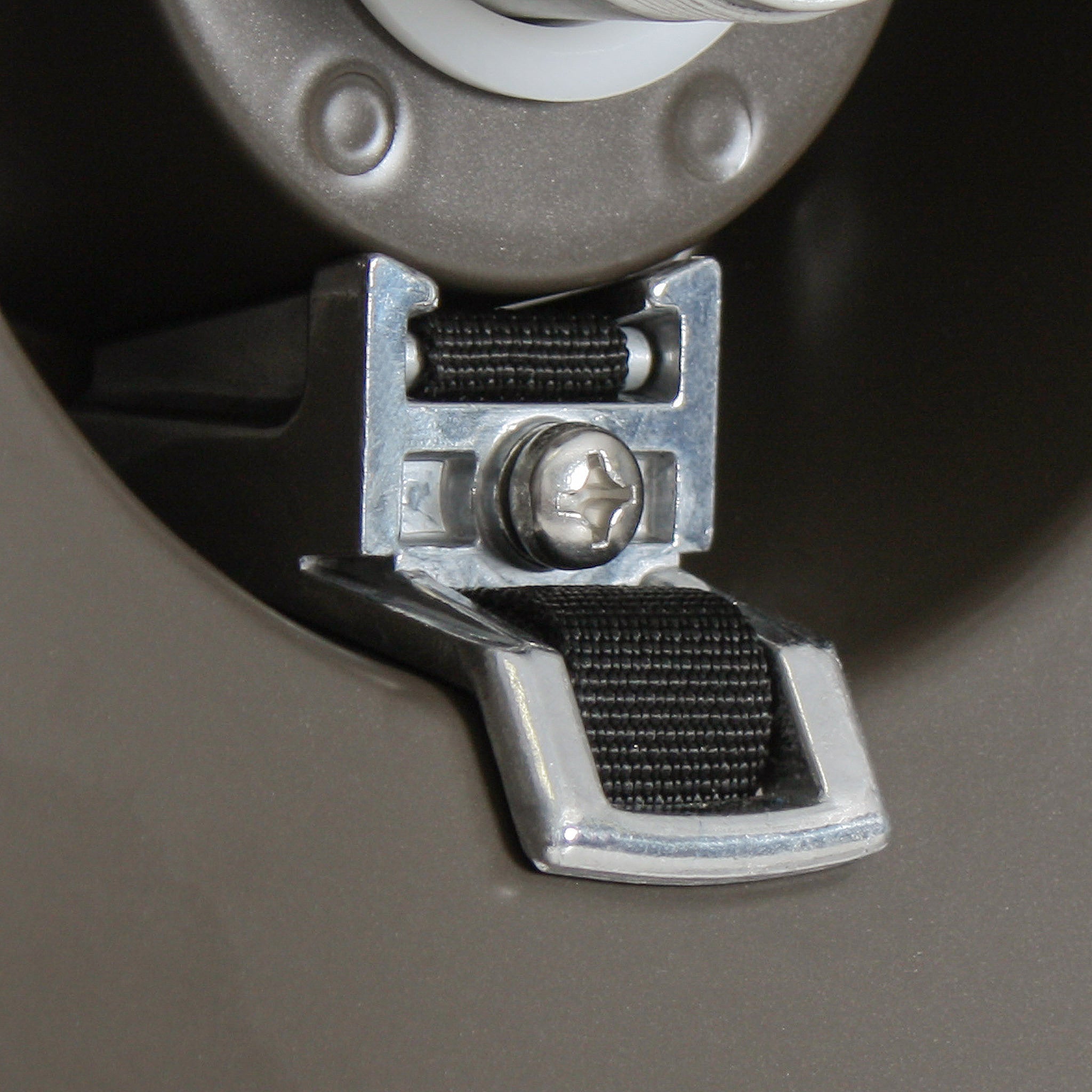 Eley hose strap assembly on hose reel flange