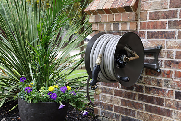 How to Mount a Garden Hose Reel to Your House