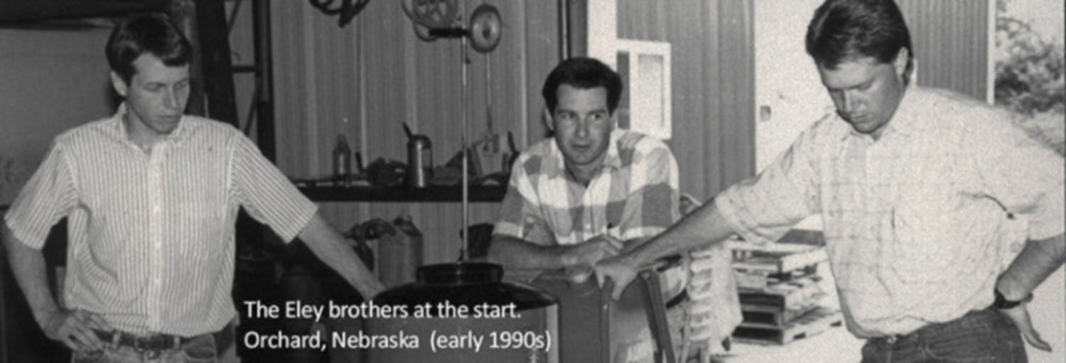 The founding brothers in 1990 at the early Eley workshop farm in Orchard, Nebraska, creating the first ELEY Hose Reels
