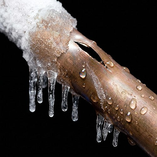 broken copper pipe with ice and freeze damage