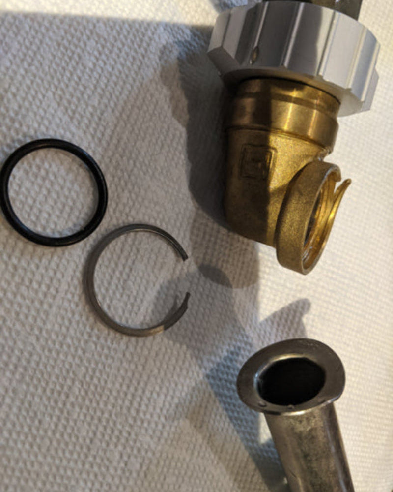 Pipe Separation, Retaining Ring Failure, and Distorted Pipe End on 4112 swivel laid out on table 