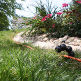 Eley Stainless Steel Ground Hose Guide in grass landscape with cord